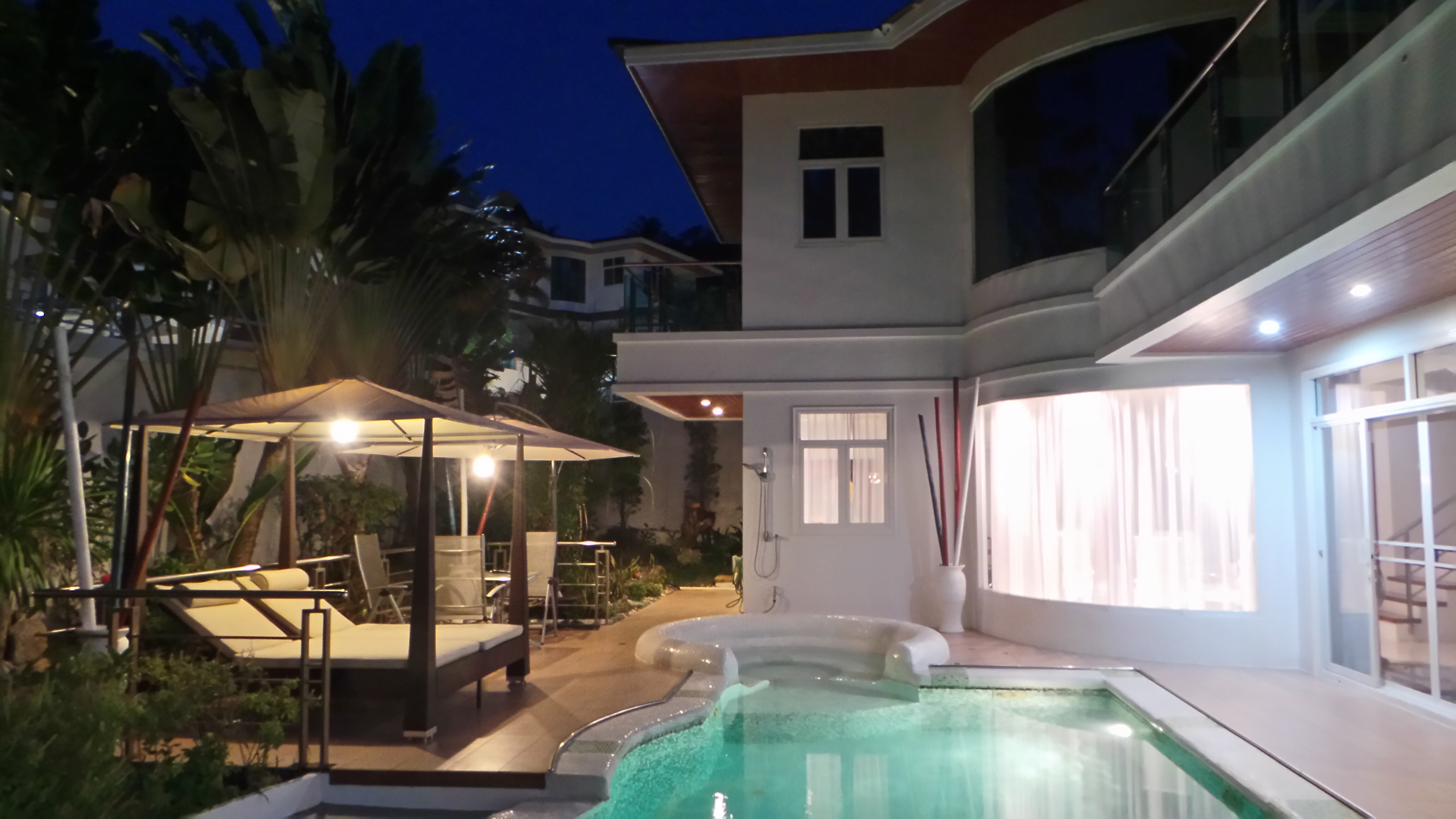 Villa veranda opens into the house with two stories in Karon Phuket